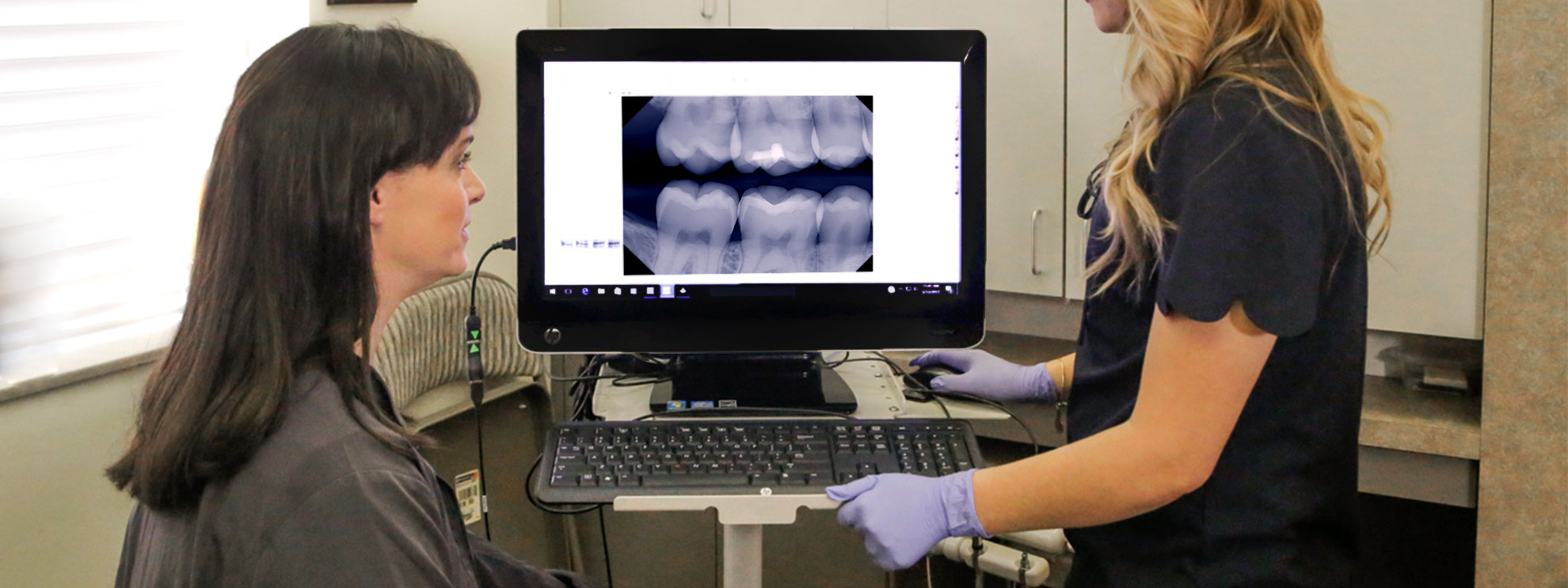 Image of hands-on DentiMax Dental Sensor Support